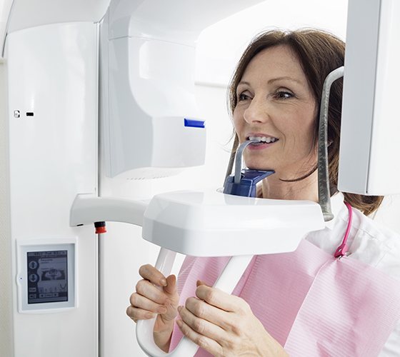 Patient receiving 3 D C B C T cone beam digital x-ray scans