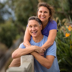 A middle-aged couple enjoying the outdoors while feeling confident and pleased with their dental implants in Lady Lake