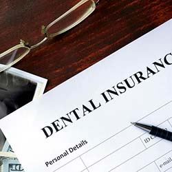 Dental insurance paperwork lying on desk