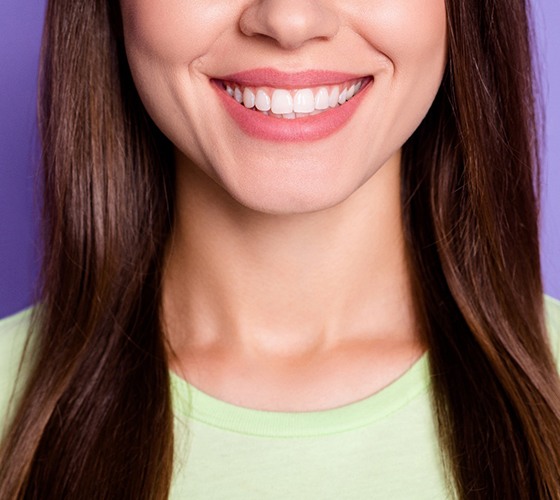 An up-close view of a person’s mouth who has received veneers