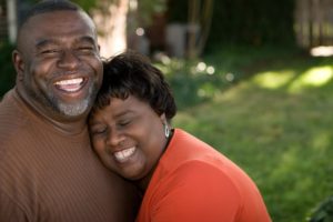 older couple smiling with dental implants in Lady Lake